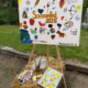 Micromata-Sommerfest 2025 auf Gut Waitzrodt: Staffelei mit Gemeinschaftsgemälde.